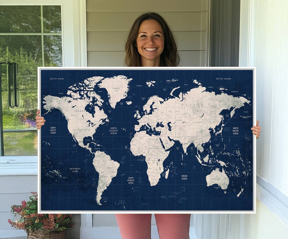 Large modern world map wall art canvas print in beige and navy; showcases a 3-panel vintage map design and is ready to hang.