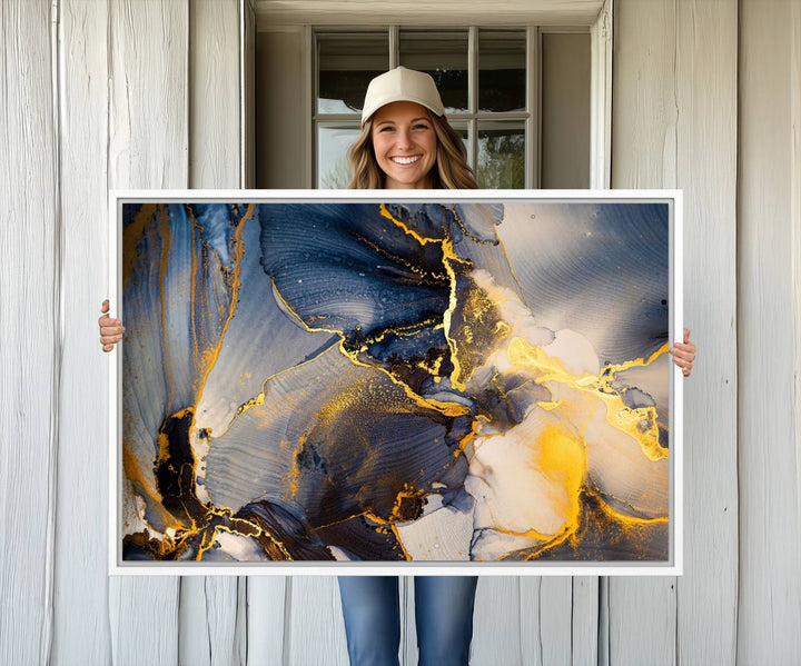 A modern luxury kitchen features a large gold and blue abstract canvas wall art print.