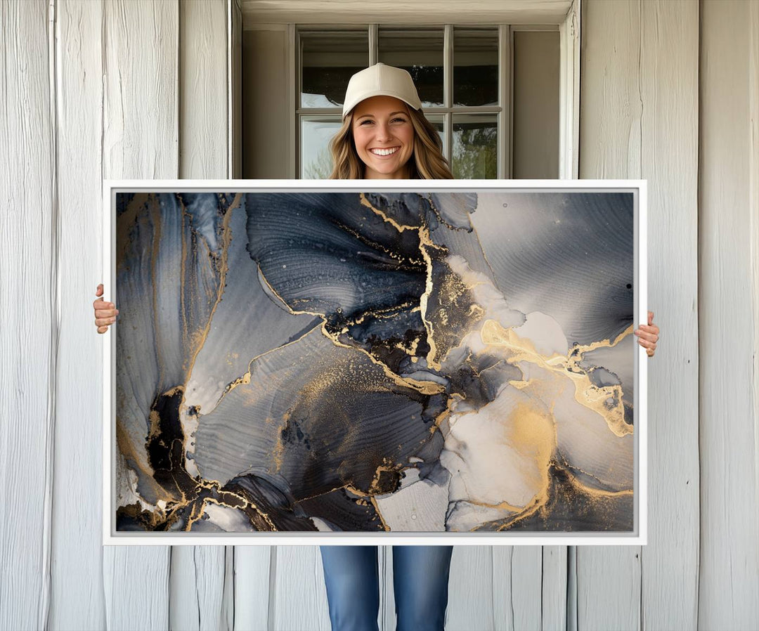 A Modern Marble Fluid Effect Abstract Wall Art with black, white, and gold swirls hangs in a modern kitchen.