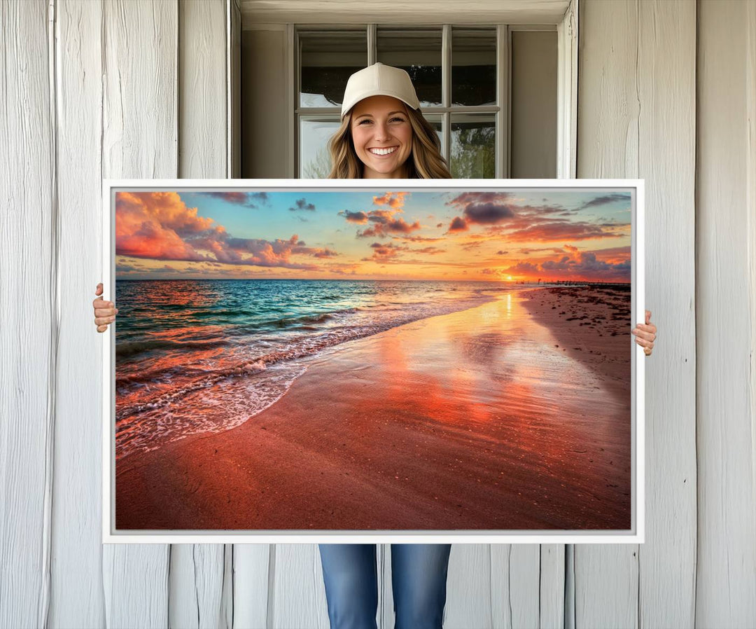 A Vibrant Sunset Beach Canvas Print with ocean waves and sandy shoreline enhances coastal-themed interiors.