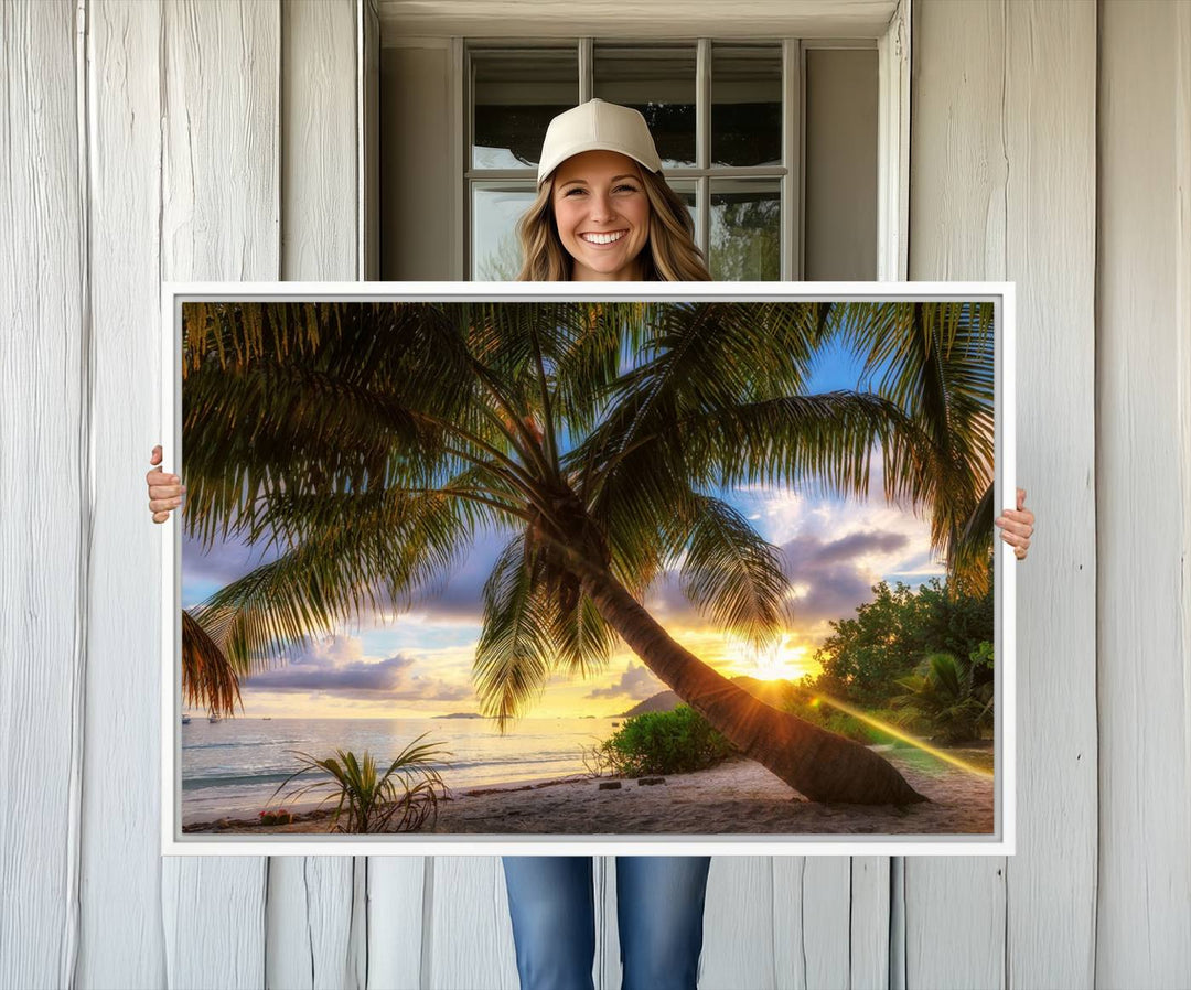 A Coastal Sunset Palm Tree canvas print hangs prominently.