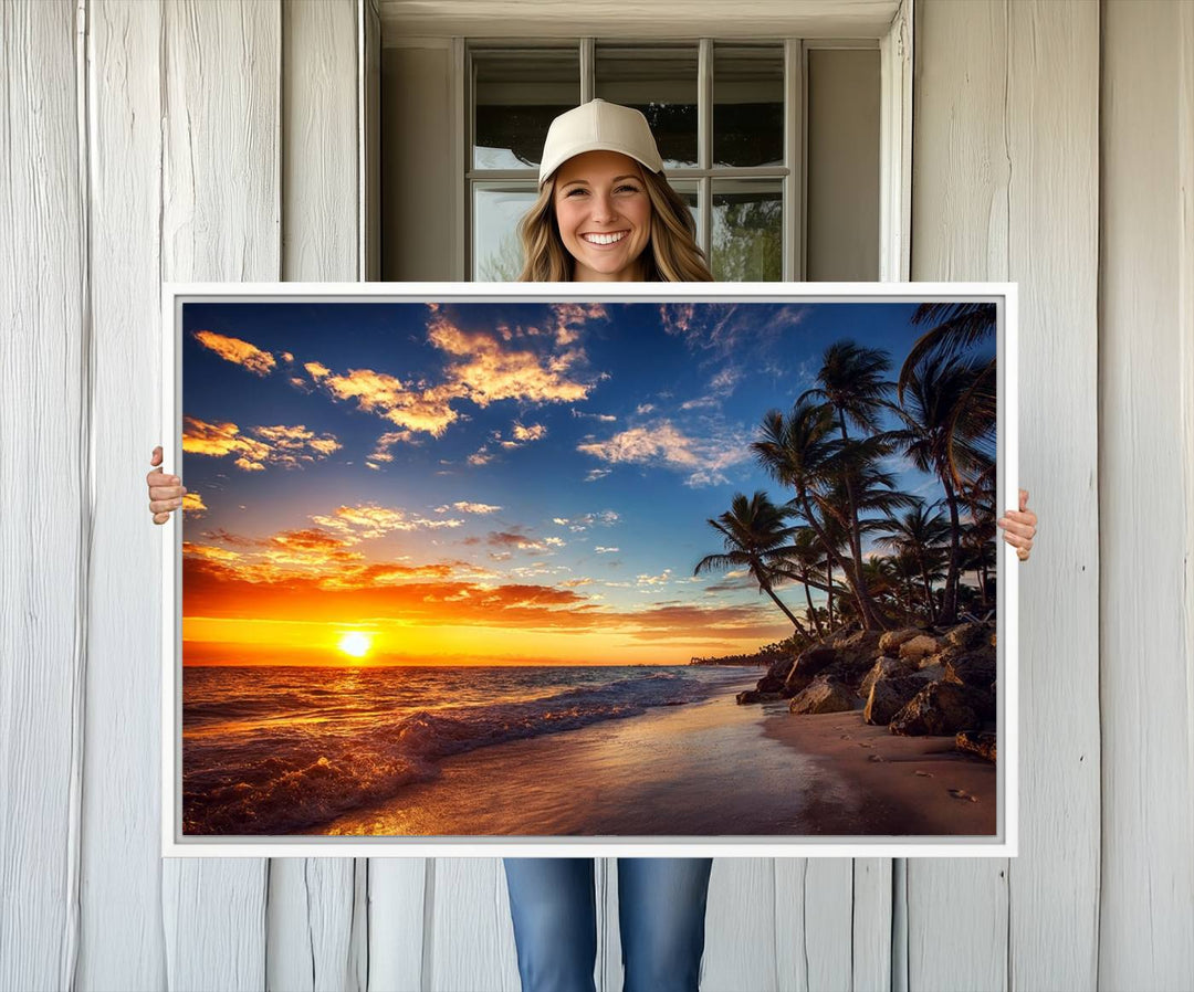 A stunning Tropical Beach Sunset Canvas Art featuring palm trees and ocean waves, created as a Giclee print.