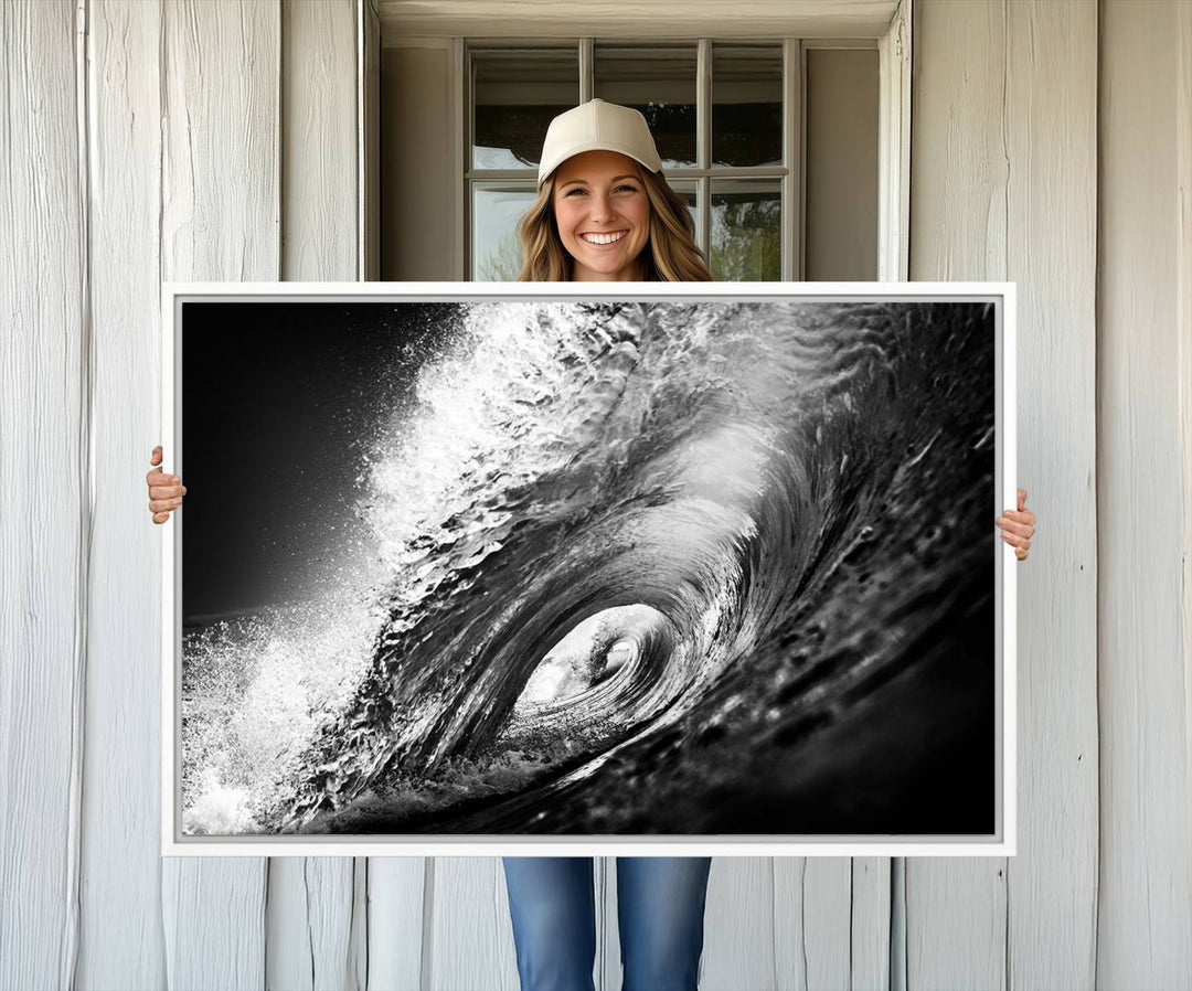 The Black Ocean Wave at Sunset Canvas Art hangs on a grey wooden wall.