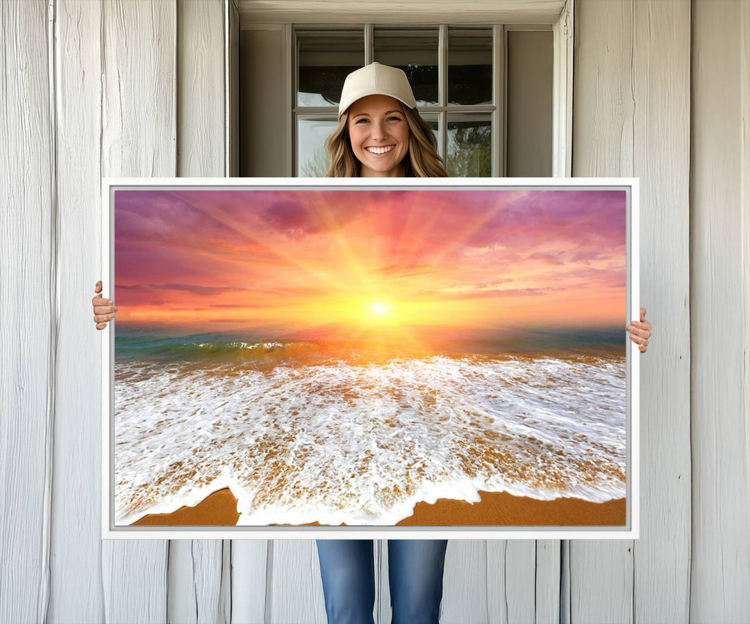 Golden Beach Sunrise 3-panel canvas art of ocean waves, hung on a wooden wall.