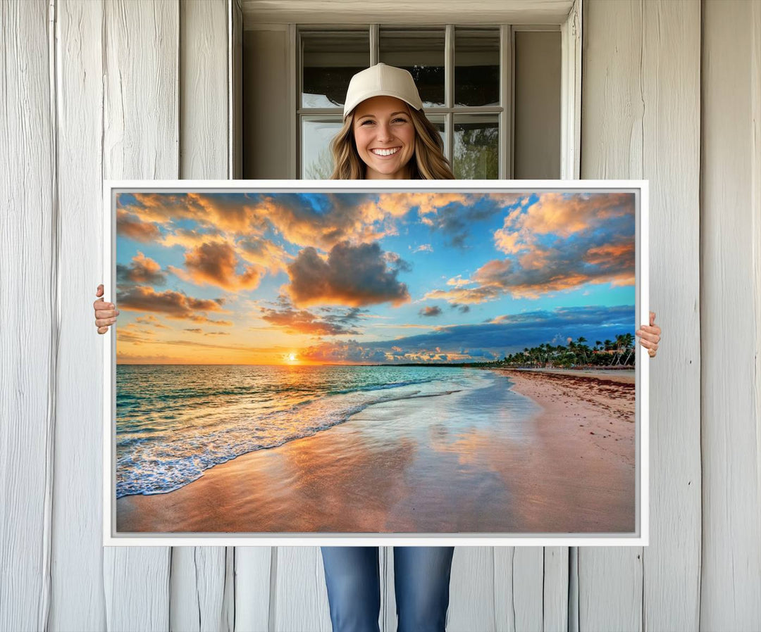 A wall displays Sunset Ocean Waves on Tropical Beach 3-panel canvas art.