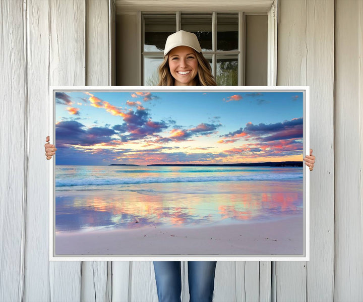 The Tranquil Pastel Sunset Beach Triptych Canvas Art hangs, showcasing its serene beauty.