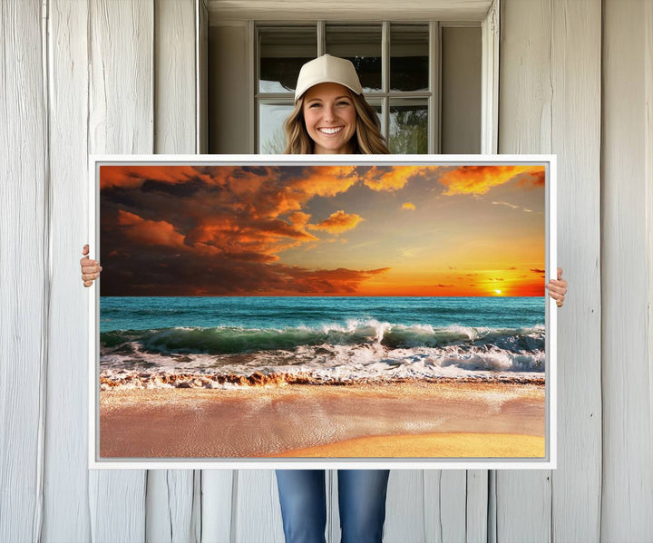 A Golden Sunset Beach triptych seascape canvas hangs on the wall.