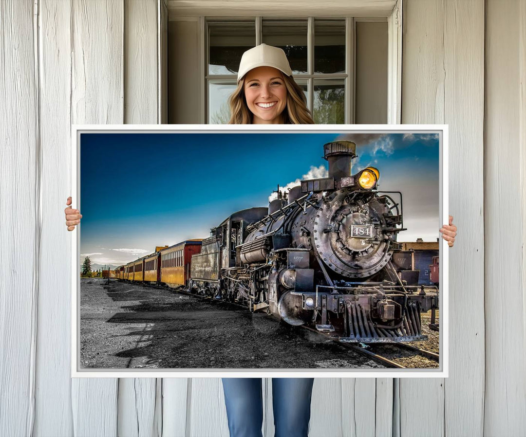 The Train Wall Art Canvas Print features a vintage steam train with a bright headlight.