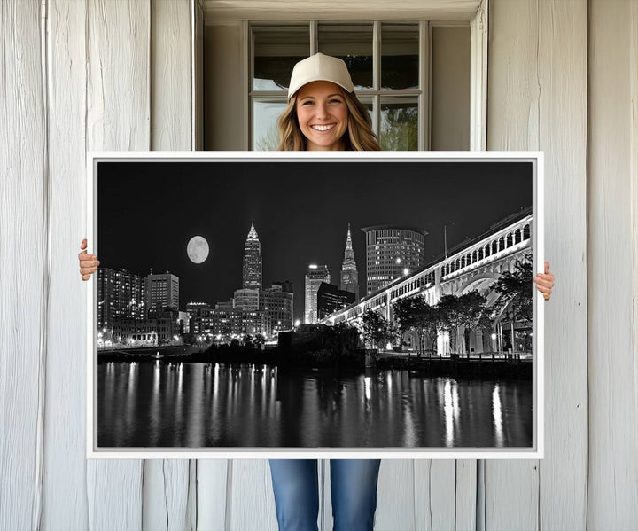 Cleveland Night Skyline Canvas Print: A museum-quality piece, ready to hang, featuring a stunning full moon and its reflections below.