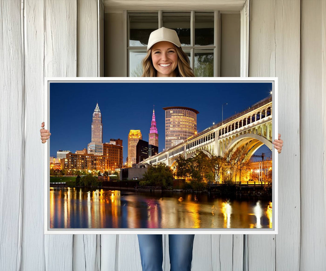 The Cleveland City Lights Canvas showcases a lit-up bridge and cityscape at night.