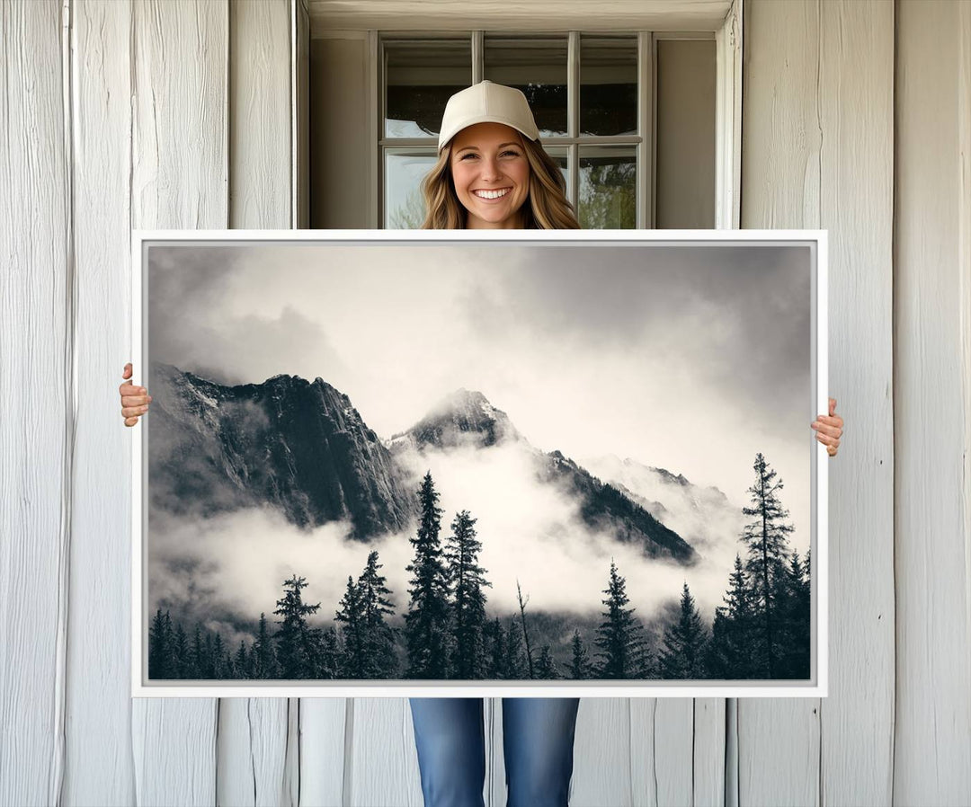 A large foggy mountain forest canvas print hangs prominently in the room.