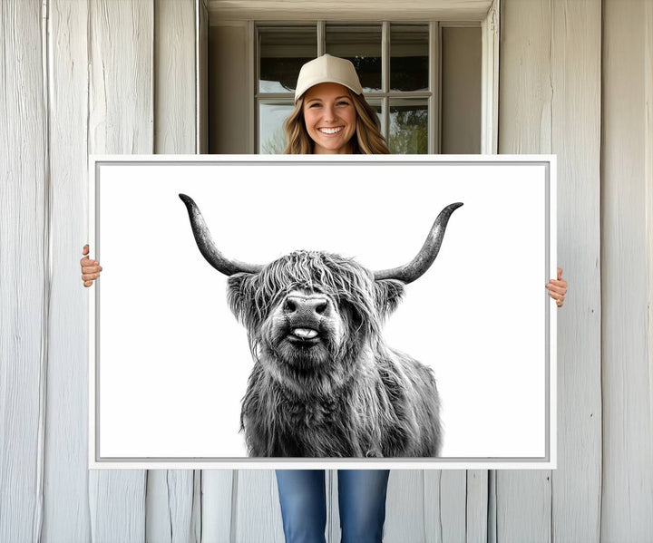 The Fanny Highland Cow art print decorates the modern kitchen, featured in black and white.