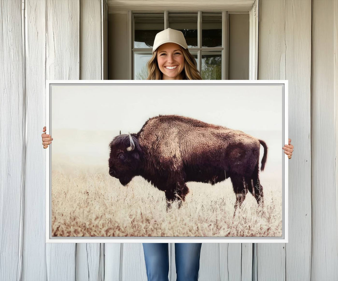 The dining room showcases the Bison in Field canvas print.