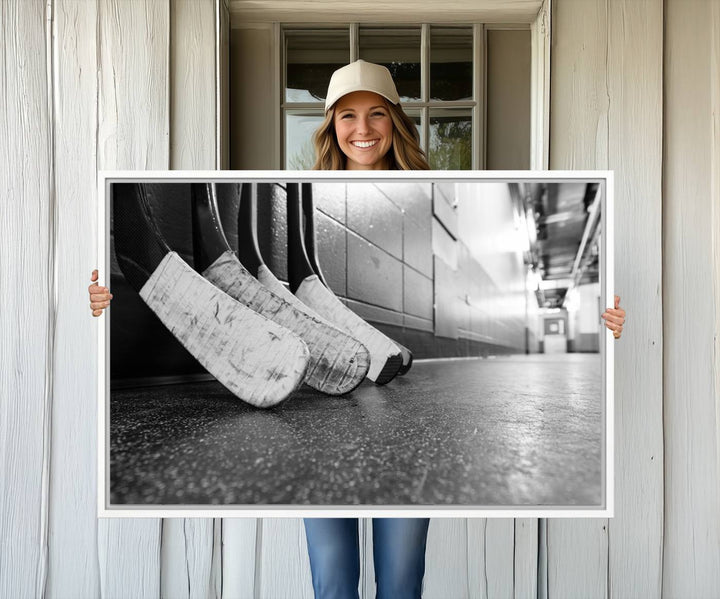 Ice Hockey Wall Art Canvas Print features a UV-protected black and white photo of hockey sticks.