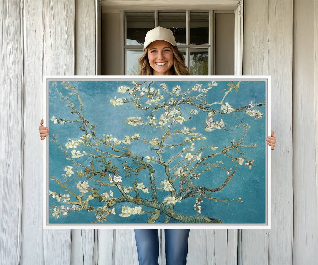 The wall art, Vincent Van Goghs Almond Blossom, stands out with its vibrant depiction against a serene blue background.