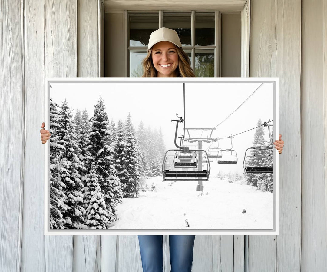 The Ski Wall Art, featuring the "Ski Lift Wall Art Canvas Print," presents a snowy scene with snow-covered spruce trees and is elegantly showcased on a dark green wall.