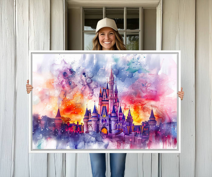 The watercolor Disney Wall Art showcases Cinderellas Castle in pink, purple, and orange hues.