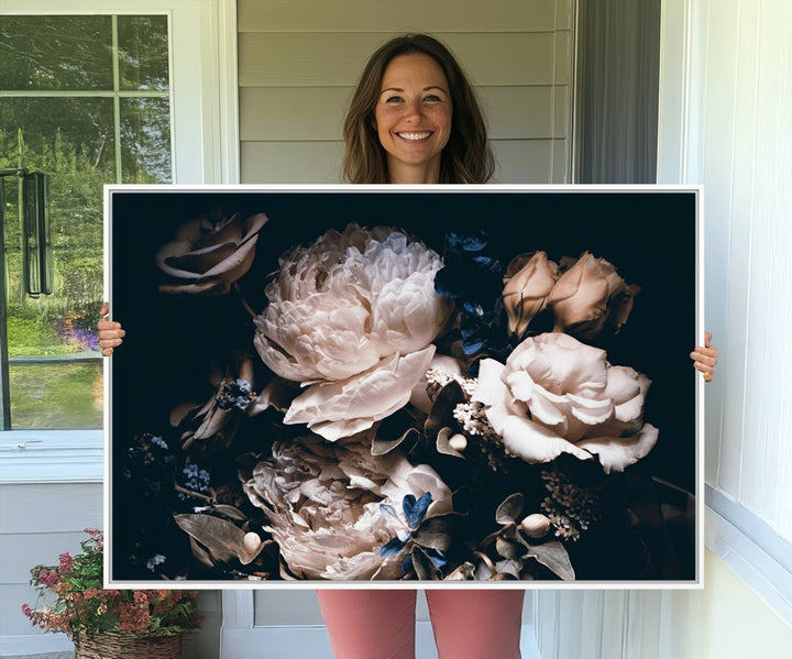 A large canvas art print of pink peonies flowers adds a vibrant touch to the space.