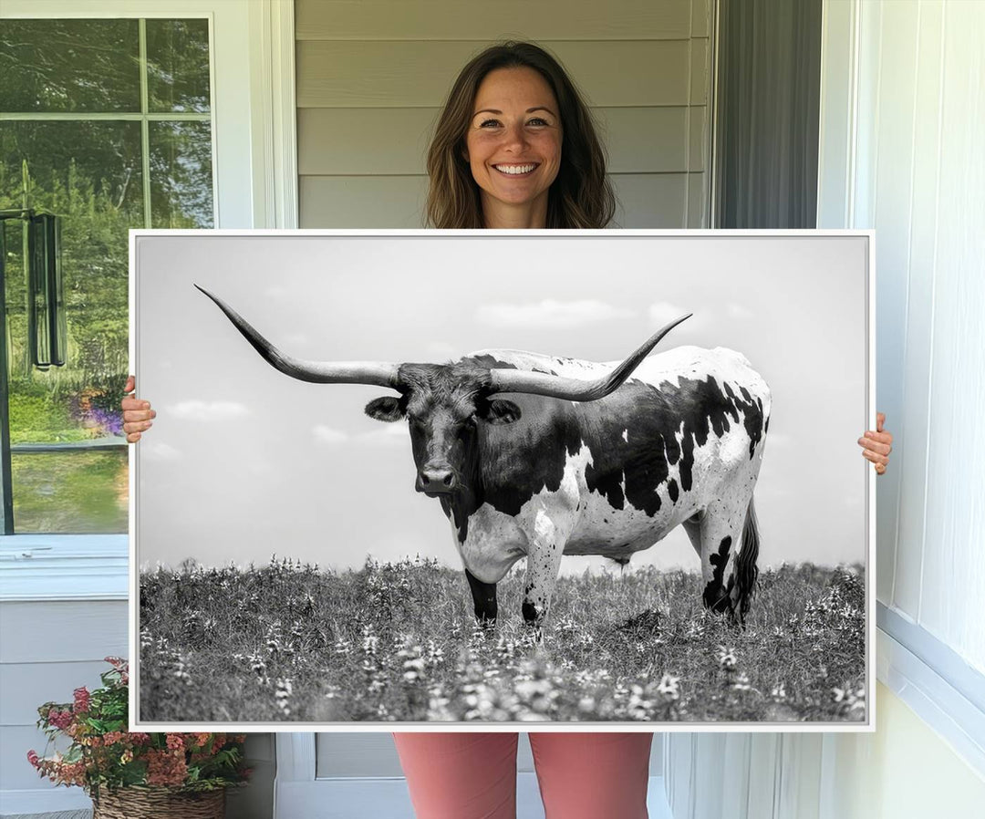 Texas Black White Highland Longhorn Cow Wall Art Canvas displayed on the wall.