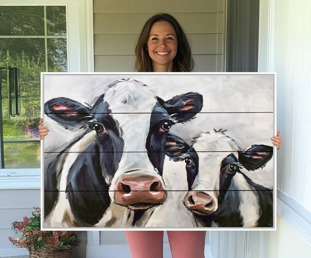 The Vintage Baby and Mom Cattle Canvas, featuring cows with black and white patches, is a prominent piece of wall art.