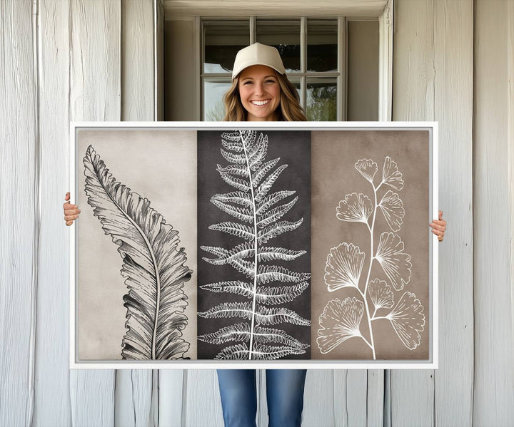 Three framed botanical wall art pieces are displayed in a bright room.