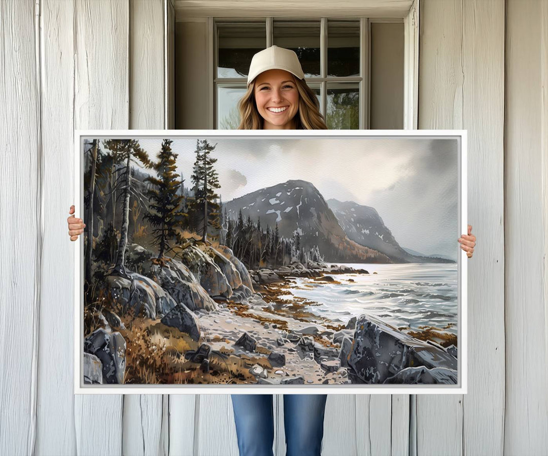 Framed wall art depicting Acadia National Parks rocky coast, trees, mountains, and sunlight over the sea; ready to hang.