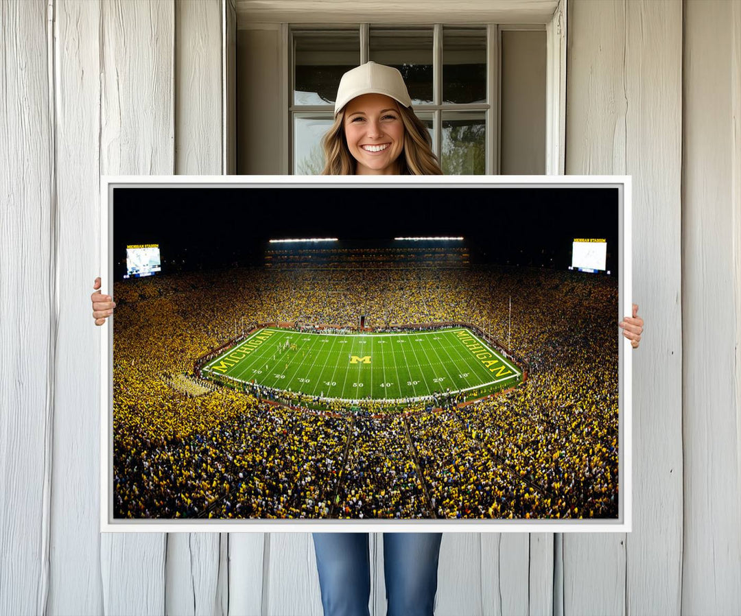 Aerial view of Michigan Stadium night game, ideal for Michigan Wolverines Football Team displayed on a triple canvas wall art.