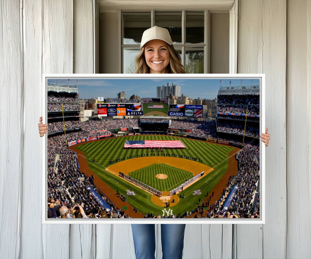 The Yankee Stadium New York wall art print features a vibrant scene of baseball fans with a large flag and players, expertly capturing the spirit of the game. This ready-to-hang décor is perfect for adding a dynamic touch to any space.