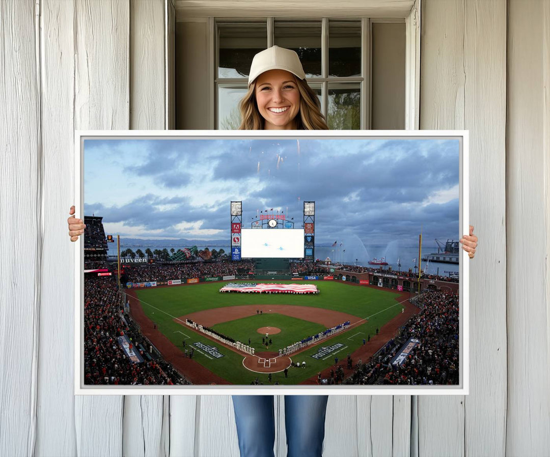 This framed 3-panel canvas MLB wall art features a giant flag and fans under a cloudy sky at Oracle Park.