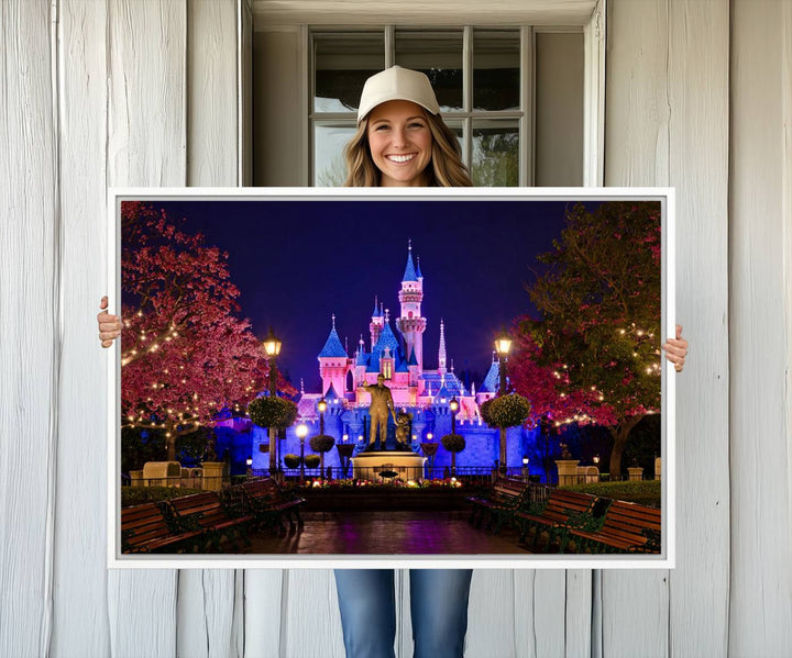 The Castle Large Wall Art is surrounded by illuminated trees at night.