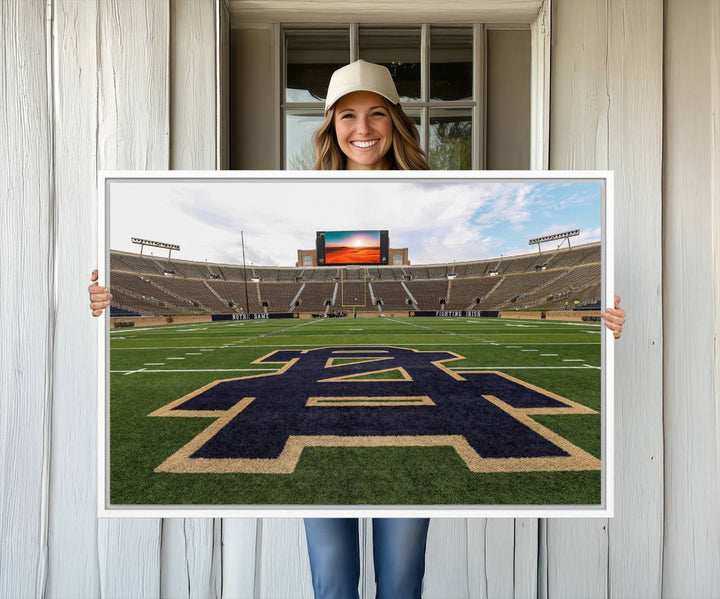 Notre Dame Stadium Triptych: This ready-to-hang giclee canvas print features a vibrant depiction of the football field adorned with an A logo and a stunning sunset.