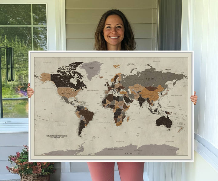 A vintage world map on beige canvas, featuring countries in brown and black shades.