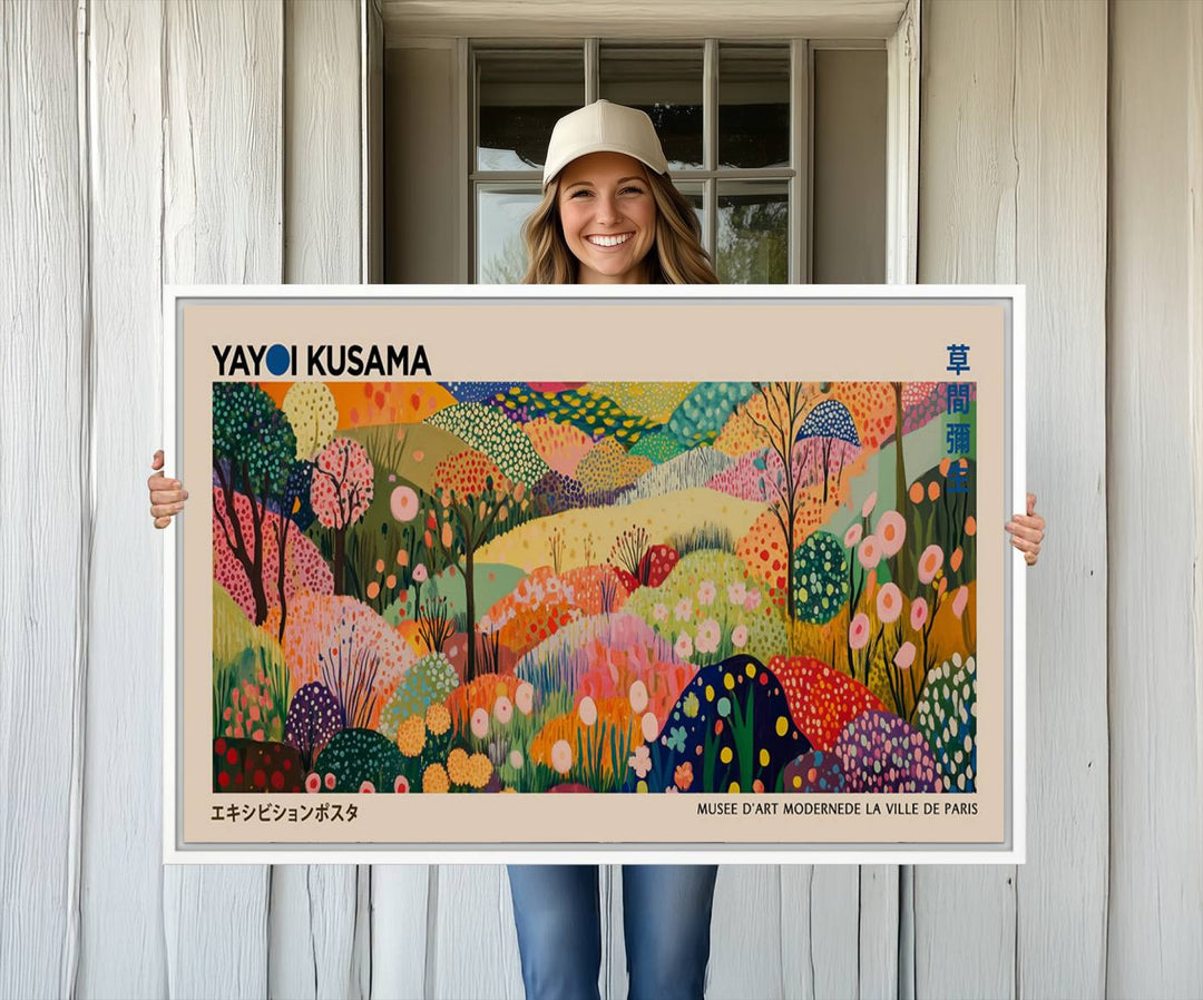 A framed Yayoi Kusama Wall Art Canvas Print features a vibrant abstract landscape adorned with flowers.