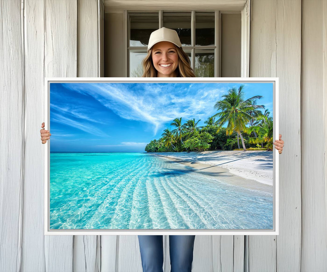 The Tropical Beach Wall Art Canvas Print showcases a serene ocean landscape with crystal clear turquoise water and palm trees, beautifully enhancing the coastal decor.