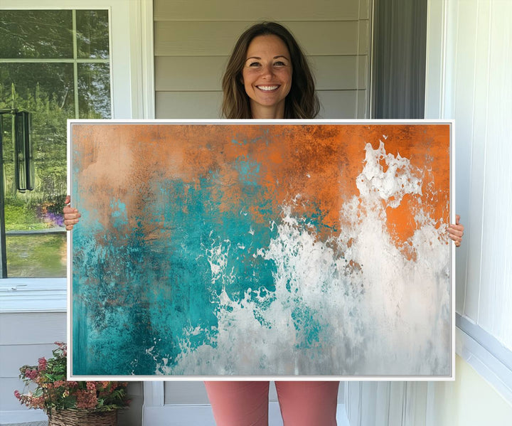 The Vintage Abstract Print - Bold Teal and Orange Canvas Wall Art is displayed on a porch.