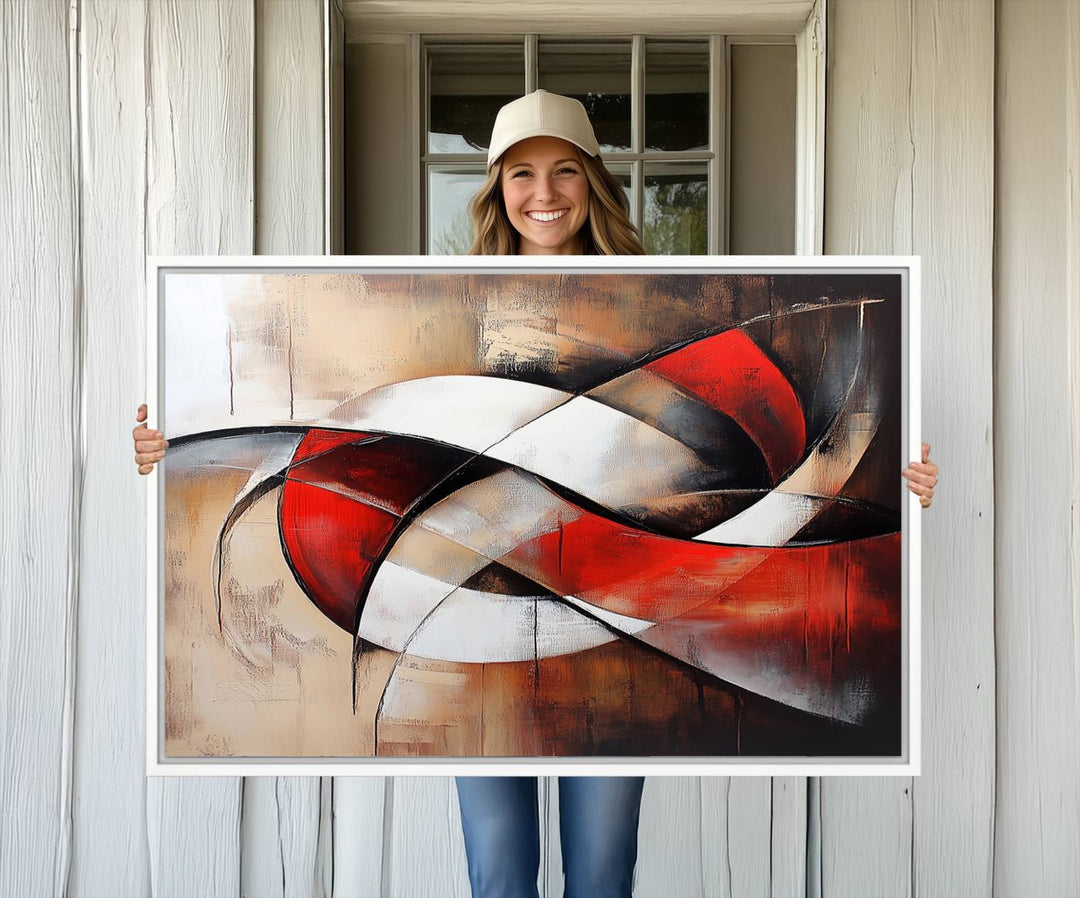 The "Abstract Wall Art - Modern Red and White Canvas Wall Art Print" features bold geometric shapes in red, black, and white on a beige background, enhancing contemporary aesthetics. This canvas print adds a striking focal point to any room, beautifully complementing the modern vibe of the space.