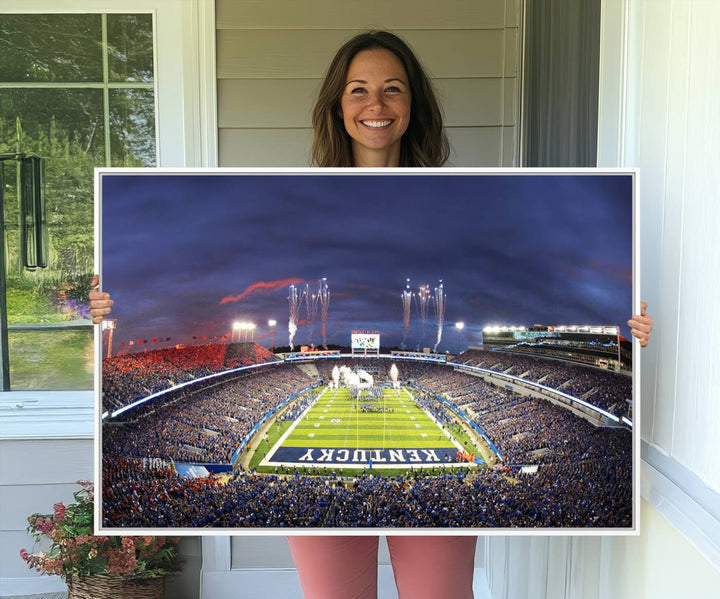 A filled stadium at dusk and fireworks overhead are beautifully captured in the Kroger Field Canvas Wall Art - Sunset Football Stadium Decor.