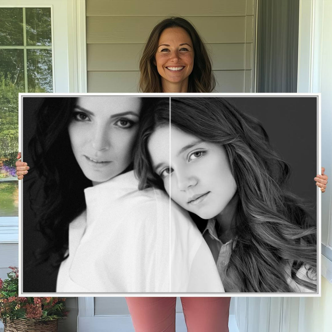 A framed wall art canvas print depicting two women on a dark background.