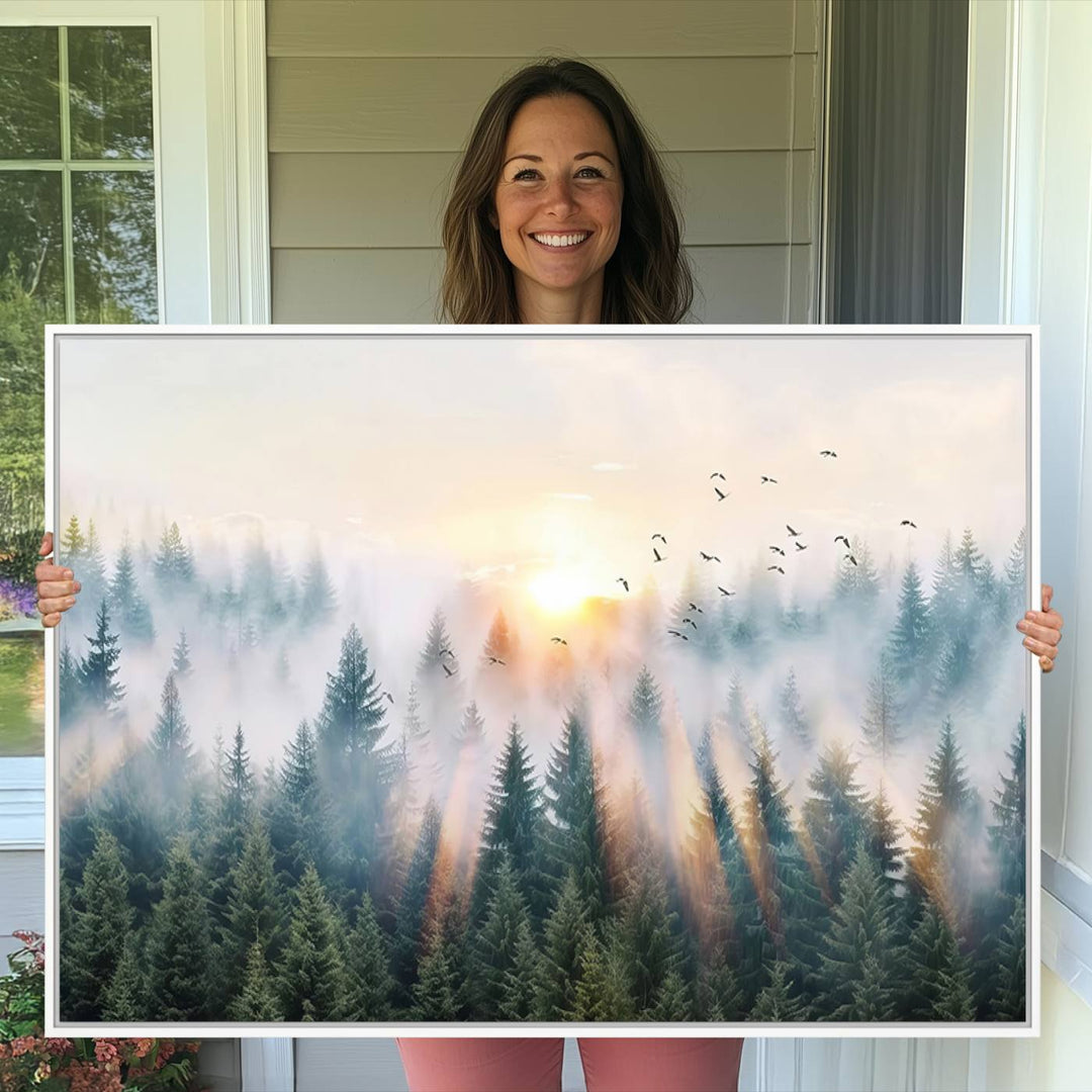 Misty Pine Forest Wall Art: A depiction of sunrise over foggy trees and birds against a bright sky; a framed woodland scene ideal for home or office decor.