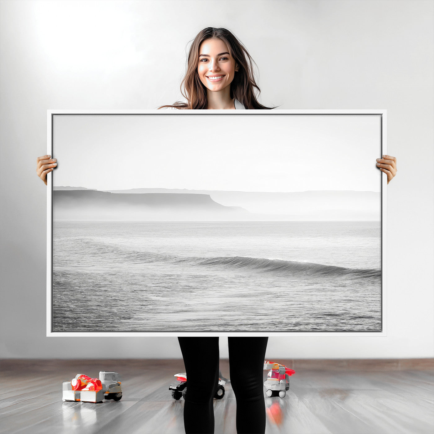 A black and white minimalist seascape featuring soft rolling waves and misty distant cliffs, creating a serene and timeless coastal atmosphere.