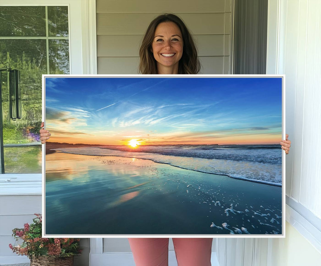 The Blue Sky and Beach Wall Art Canvas Print features a vibrant orange sky reflecting on wet sand.