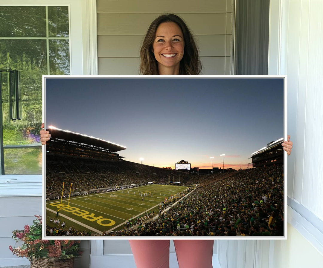 Canvas artwork depicting an Oregon Ducks football game at Autzen Stadium, capturing a sunset and packed stands.