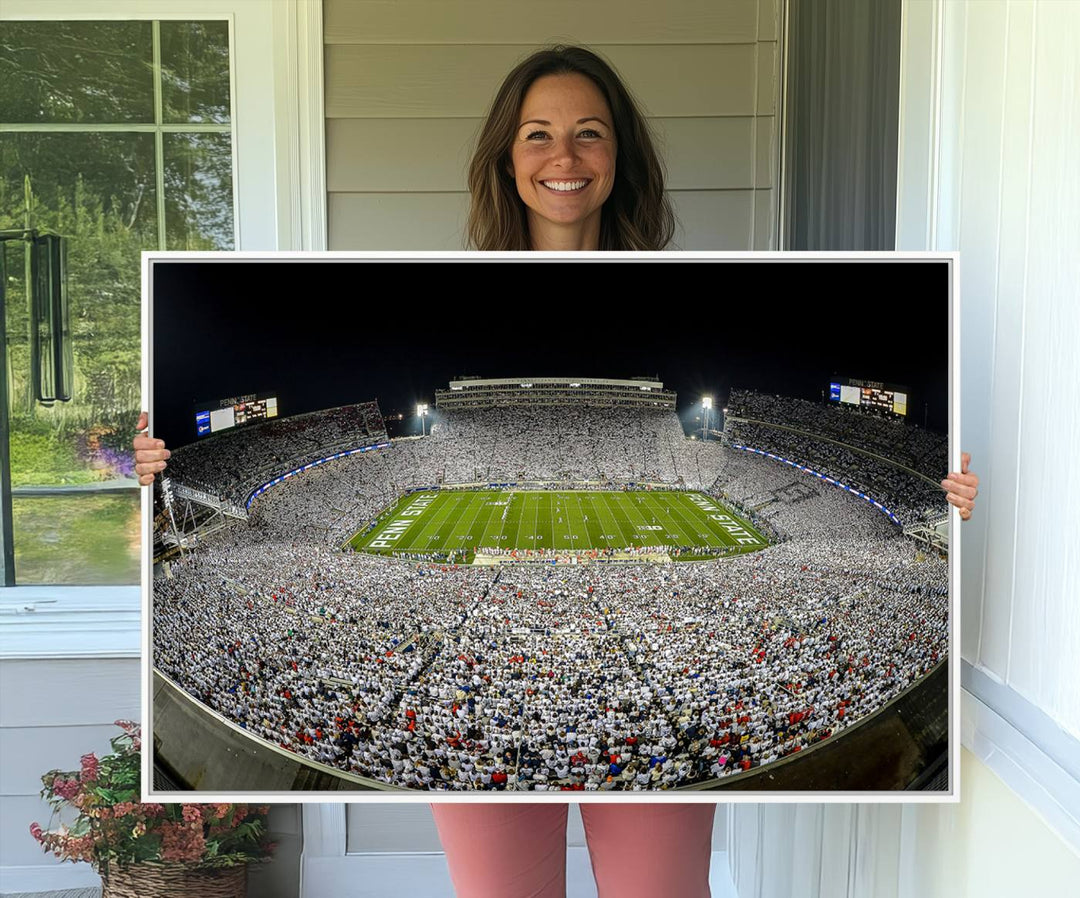 The triple canvas wall art depicts Beaver Stadiums vibrant atmosphere during a night game from the end zone.