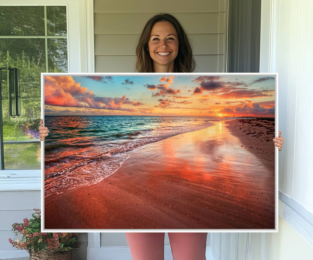 An Ocean Canvas Print depicts a sunset over a beach with reflections.