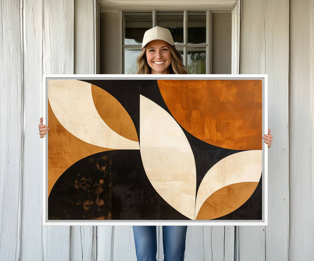 Geometric abstract wall art print featuring leaf shapes in brown, beige, and black.