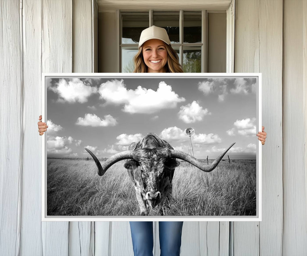 Longhorn Cow Field Canvas Print featuring rustic charm with a windmill backdrop.