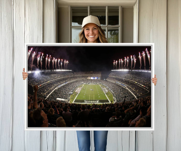 The wall art of Eagles Field Stadium showcases nighttime fireworks over a full stadium.