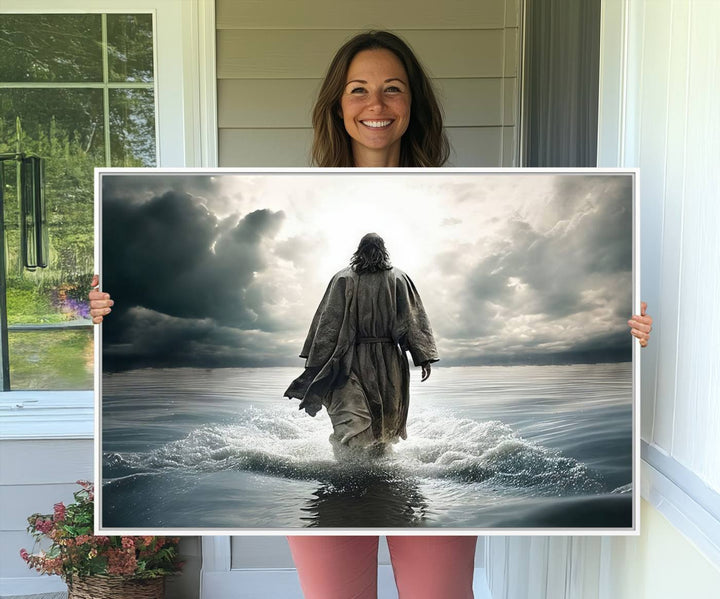 A canvas wall art depicting a figure walking on water beneath dramatic clouds, designed as inspirational religious imagery and ready to hang.