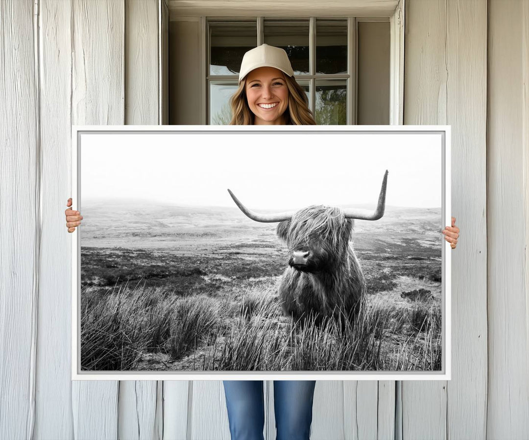 The Scottish Highland Cow black and white canvas print adds rustic farmhouse charm to any wall.