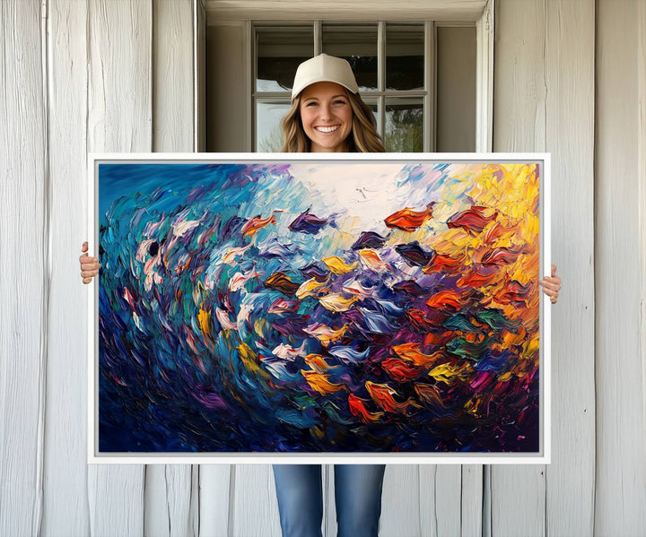 The Vibrant Abstract Fish Swarm Art features a colorful 3-piece canvas that adds a pop of color.